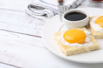 Traditional asian breakfast with tasty kaya toasts and half-boiled eggs served on white wooden table, closeup. Space for text