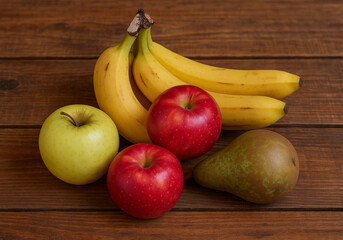 Apile of different fruits on a wooden table 