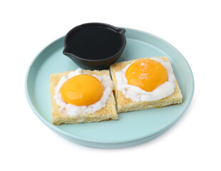 Tasty kaya toasts with half-boiled eggs and soy sauce isolated on white. Traditional asian breakfast