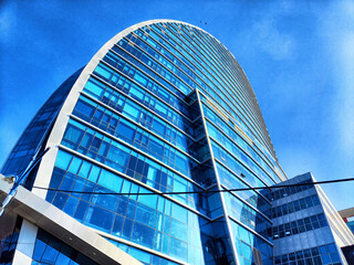 This striking example of modern architecture features a unique and eye-catching curved design that...