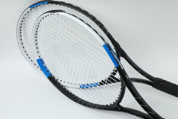 Tennis racket and ball on white background