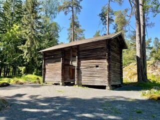 Old dilapidated ancient wooden house in the village. Finland, 19th century