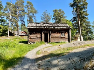 Old dilapidated ancient wooden house in the village. Finland, 19th century