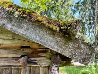 Rood construction. Old dilapidated ancient wooden house in the village. Finland, 19th century.