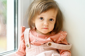Baby girl near the window