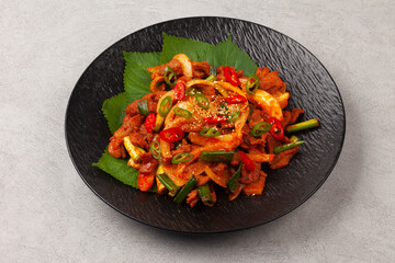   A dish made by stir-frying pork with various seasonings, then stir-frying it again with chives, onions, etc.