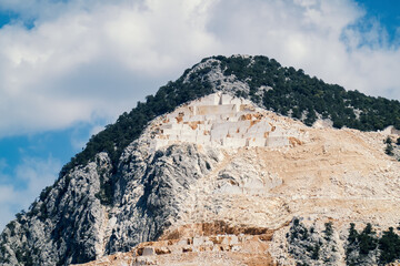 White marble extraction in mountains, natural marble stone mining quarry