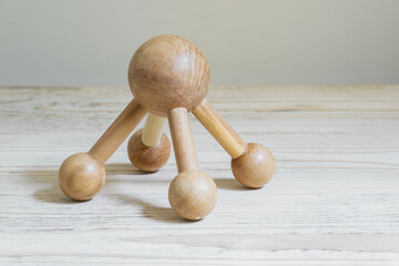 Massager made of natural juniper wood for treatment of handrosis or osteochandrosis of spine