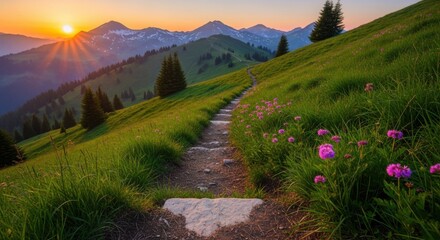Pathway ascends a grassy hillside at dawn with mountains in the distance