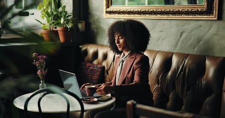 Remote work, coffee and woman on laptop in cafe for typing email, project draft or online campaign. Beverage, tea or social media analyst in restaurant for business blog, article deadline or research - Powered by Adobe