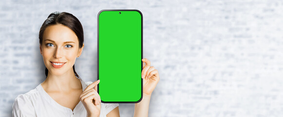 Portrait image - happy smile cute businesswoman business woman show point big mockup cell phone,...