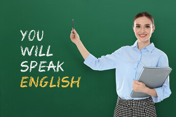 Teacher pointing at green chalkboard with text You Will Speak English. Language course