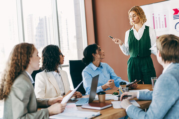 Diverse professionals in a productive office meeting collaborating on business strategies with teamwork and communication.
