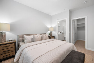 Bedroom with a white bed and a white dresser