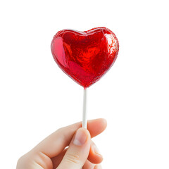 Hand holding a vibrant red heart-shaped lollipop.