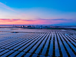 Solar photovoltaic power plant at sunset