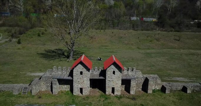 Aerial footage of Arutela Roman Castrum and Hidrocentrala Turnu power plant on Olt River, Romania
