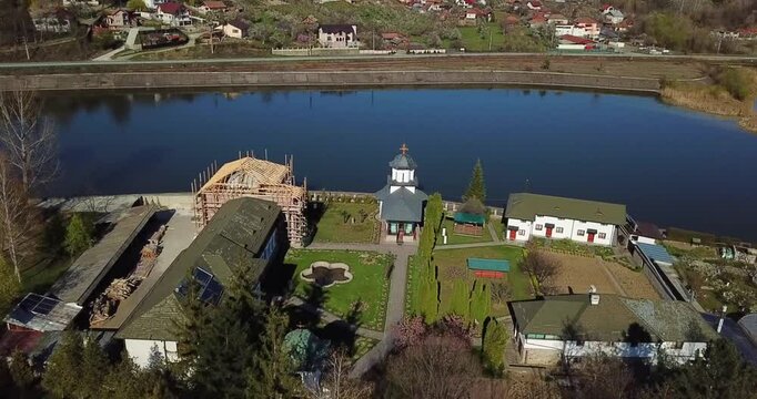 Aerial view of the Ostrov Monastery on the Ostrov Island on Olt River in Constanta County, Romania