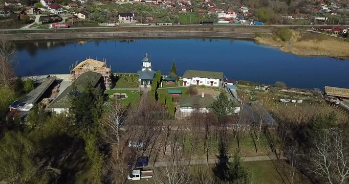 Aerial view of the Ostrov Monastery on the Ostrov Island on Olt River in Constanta County, Romania