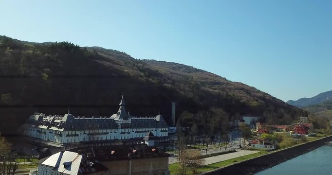 Aerial footage of a luxury hotel overlooking the Olt River in Calea lui Traian, Calimanesti, Romania