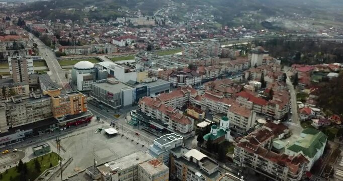 Aerial view of the downtown of Ramnicu Valcea, Romania showcasing urban buildings at sunset