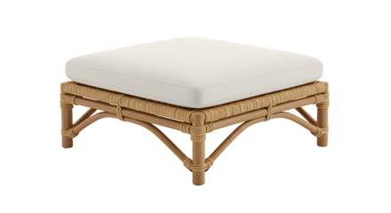 Elegant square ottoman with a soft white cushion on a woven rattan base, set against a neutral background in a cozy living space