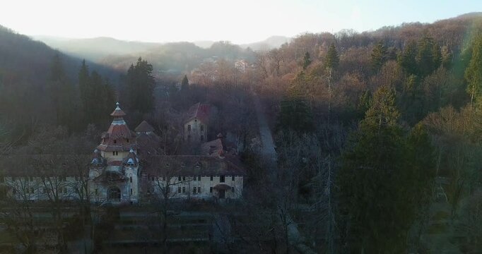 Aerial footage of the Sanatoriul Baile Govora Nursing home at sunset in Baile Govora, Romania