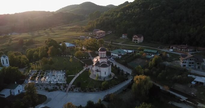 Drone footage of the Church "Healing Spring" Troianu at sunset in Ramnicu Valcea, Romania