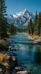 Majestic mountain landscape with clear river flowing through lush forest under bright blue sky