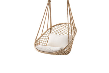 Obraz premium Rattan swing chair with cream cushions, rope hanging system, bohemian furniture, outdoor relaxation seat, isolated on a transparent background