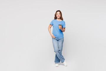 Full body young woman she wears blue t-shirt casual clothes hold takeaway delivery craft paper...