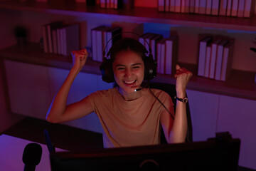 Victorious Gamer Celebrating in a Dynamic Setup