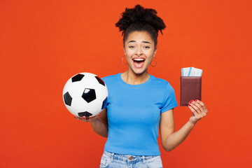 Young surprised tourist woman fan wears basic blue t-shirt cheer up support football sport team...