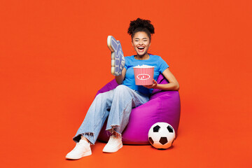 Full body young happy woman fan wear blue clothes foam 1 fan glove finger up cheer up support...