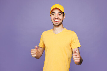 Professional happy delivery guy employee man wear yellow cap t-shirt uniform workwear work as...