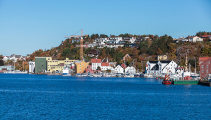 Vivid coastal landscape showcasing a charming harbor town, Norway