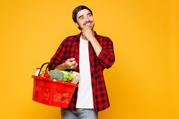 Young minded man he wear casual clothes hold basket bag for takeaway mock up with food products...