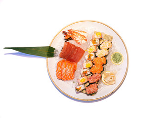Assorted sushi platter with nigiri and rolls on ice