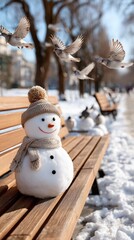 Obraz premium A cheerful snowman sits on a bench in a winter park, brightening the snowy landscape as birds flutter nearby
