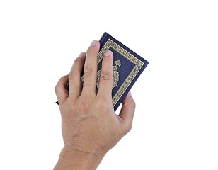 Hand Holding the Holy Quran – Islamic Faith and Devotion