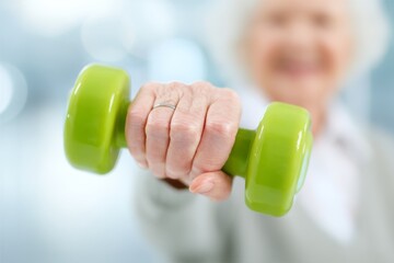 A physiotherapist specializing in modern rehabilitation techniques works with a female client