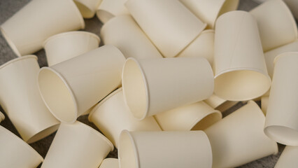 Scattered Pile of Plain White Disposable Paper Cups. Eco-Friendly Drinkware for Events, Offices, or Crafts