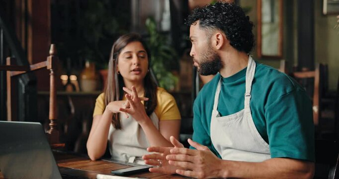 Waitress, team and laptop with discussion at cafe for review, smile and report for inventory at diner. Man, woman and barista with feedback, solution and checklist with PC for planning at restaurant