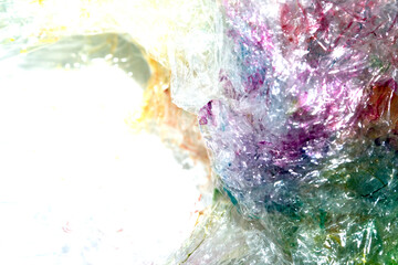 Absract background of shiny plastic and bubbles dreating bright sci-fi style texture background