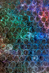 Absract background of shiny plastic and bubbles dreating bright sci-fi style texture background