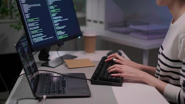Close-up woman hand typing on keyboard software technology cyberspace programmer coding laptop working internet network online