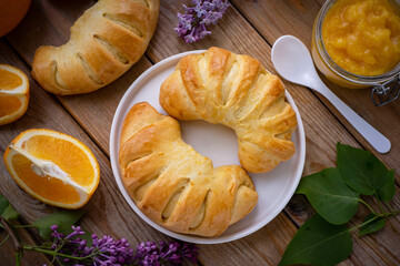 Sweet orange-filled buns for breakfast. Orange-filled buns for dessert. Top view. Close-up