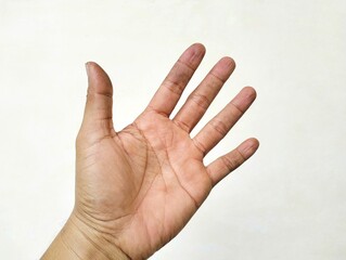 Close-up of a human hand with fingers spread wide against a plain white background. The open palm...