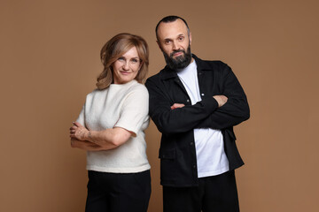 Portrait of lovely couple on brown background
