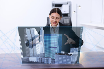 Building information modelling. Woman using virtual screen in office